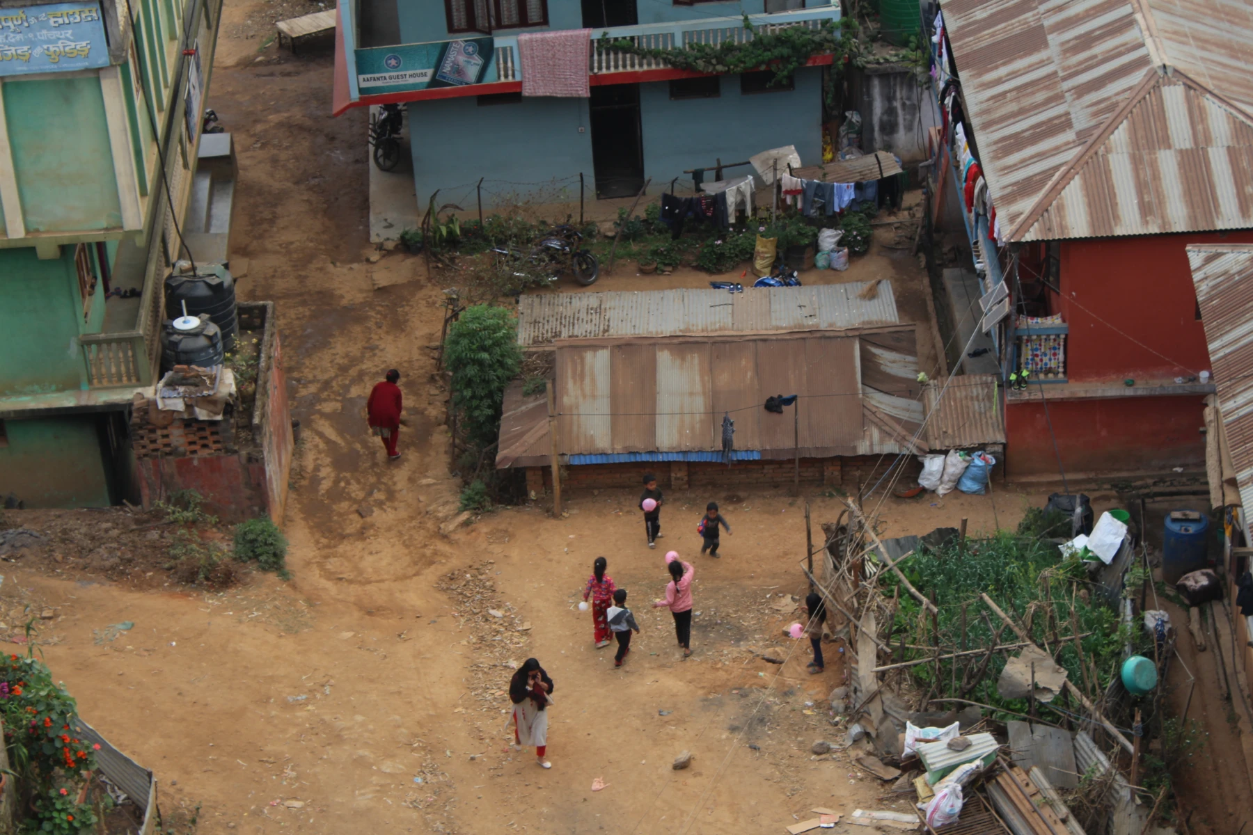 Children playing in the streets of Phidim new town development site when vehcile centric planning to disrupt thepeople centric patterns